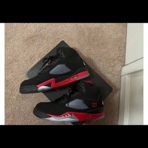 Jordan 5 Top 3 size 9.5. Black, White , red and little bit of purple.